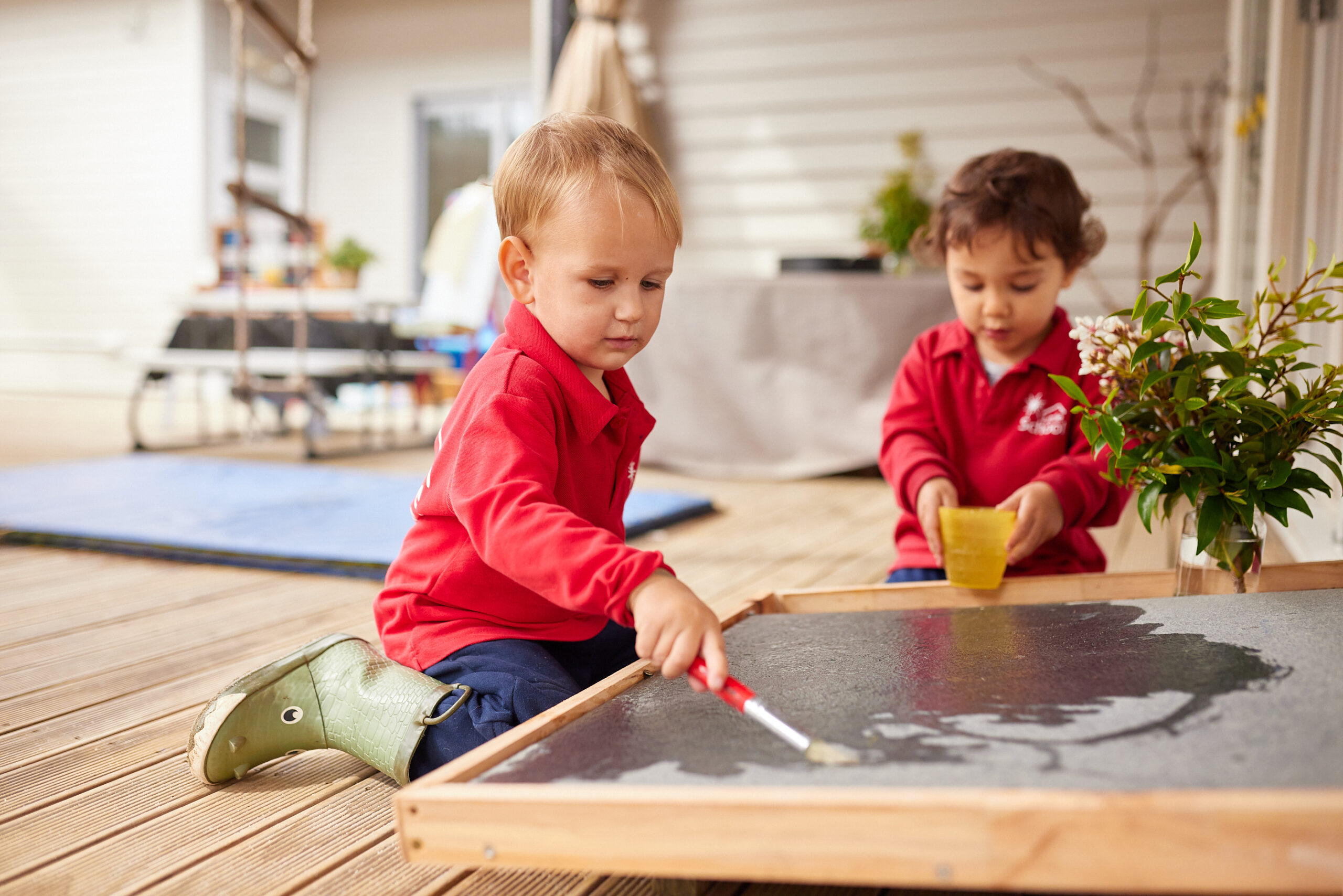 An image of kids painting and exploring their creativity