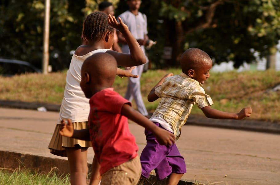 An image of children playing tag