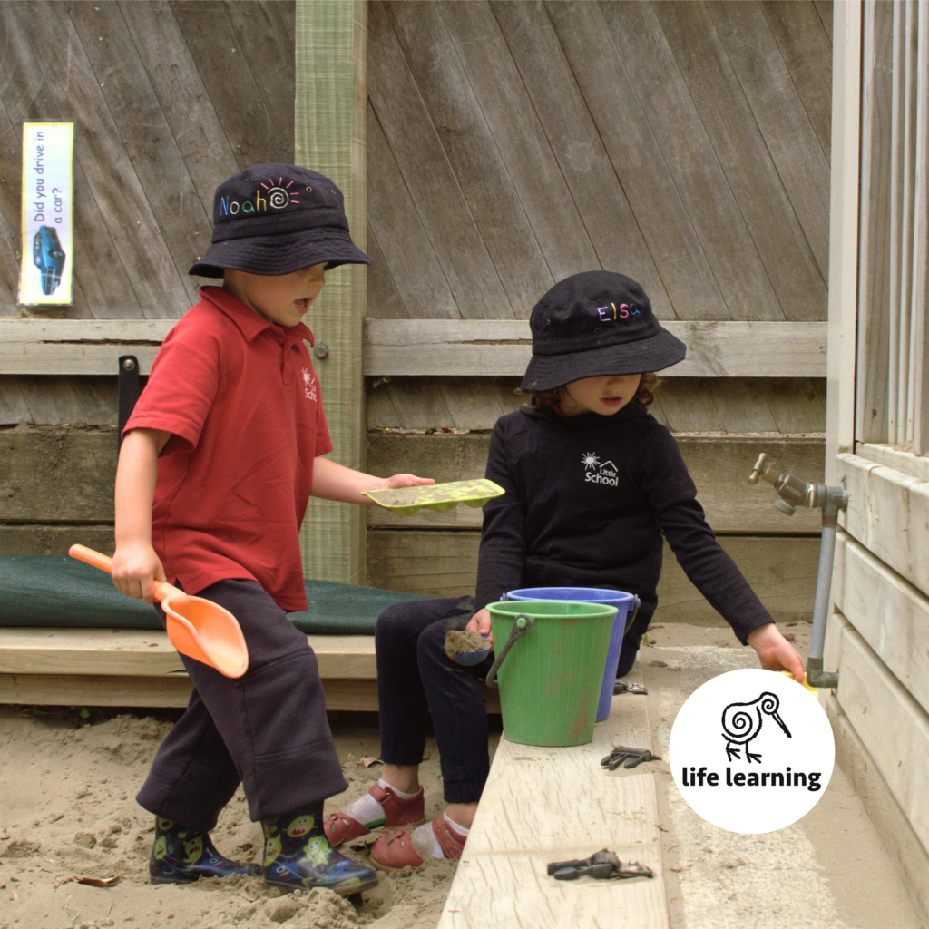 Children playing outdoors with open-ended materials